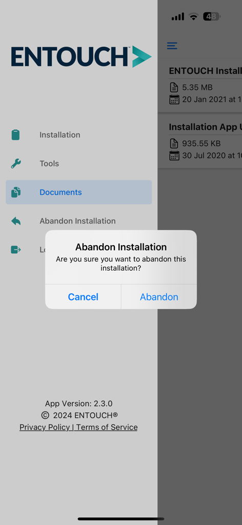 ENTOUCH Installer Tool app interface showing a sidebar menu and a confirmation dialog to abandon installation