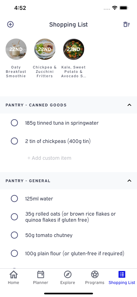 Emily Skye FIT: Workout App - A mobile app interface displaying a categorized shopping list for fitness meal plans including pantry and canned goods