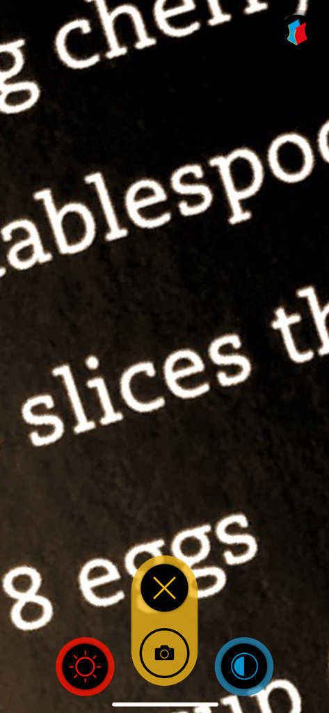 visor - magnifier - Visor magnifier app displaying magnified recipe text in high-contrast white on black mode with large colorful buttons.