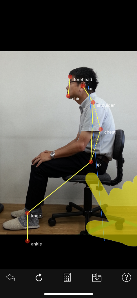 SittingPostureCHECKER - plus - A side view of a man sitting in a chair with red markers for posture analysis.