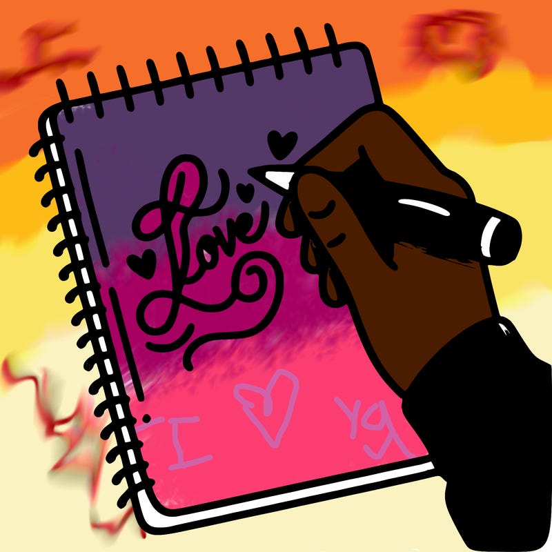 a hand writing “love” in calligraphy on a notebook