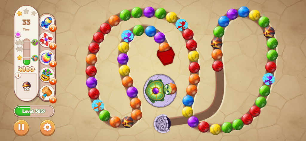 Gameplay screenshot of Marble Woka Woka showing a turtle shooting colored marbles in a winding puzzle level