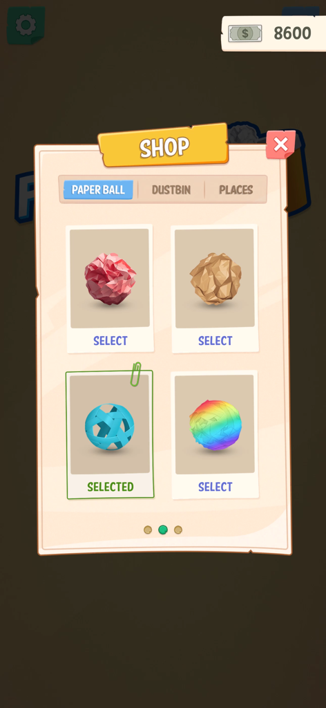 Menú de la tienda del juego en Office Paper Toss mostrando varias skins de bolas como papel arrugado y bolas de arcoíris