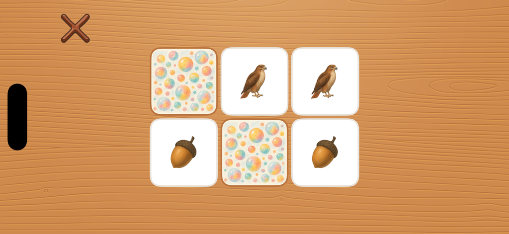 iTrace for Schools - Um minijogo de jogo da memória no iTrace para Escolas com peças apresentando pássaros e bolotas em um fundo de madeira
