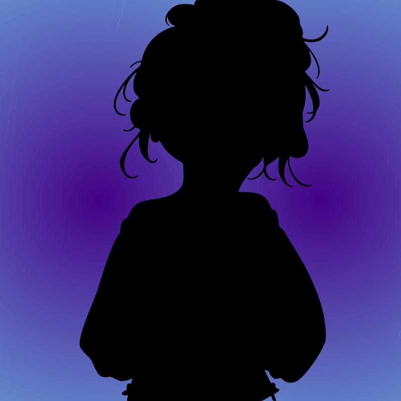 girl with a messy ponytail glasses a baggy crop top and jean shorts