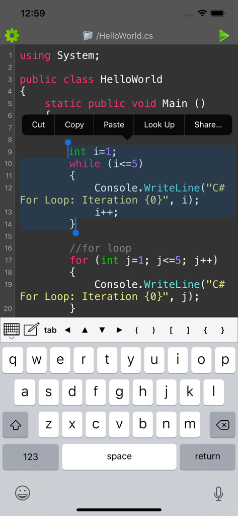 C sharp code editor interface on a smartphone with text selection and custom programming keyboard