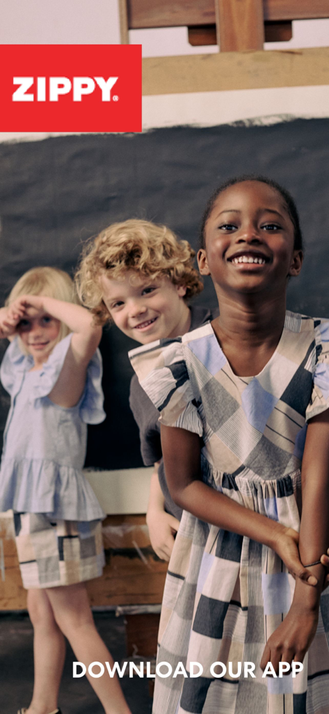 Three smiling children wearing stylish outfits from Zippy Kidstore