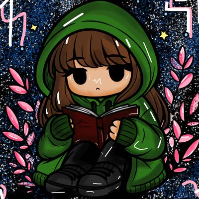 girl in oversized hoodie reading a book