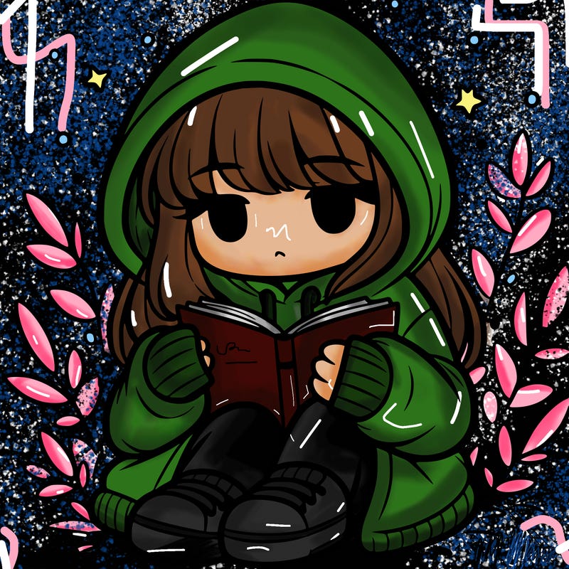 girl in oversized hoodie reading a book