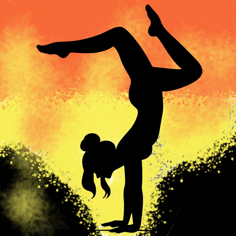 a woman doing a handstand