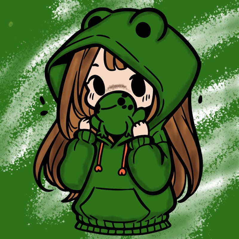 a girl holding a froggy hoodie