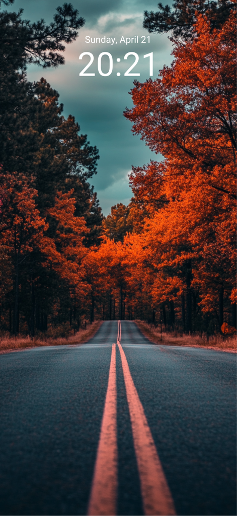 Wallpaper 4K & HD Backgrounds - Pantalla de bloqueo de iPhone con un fondo de pantalla de naturaleza de alta definición de un camino a través de vibrantes árboles de otoño naranjas