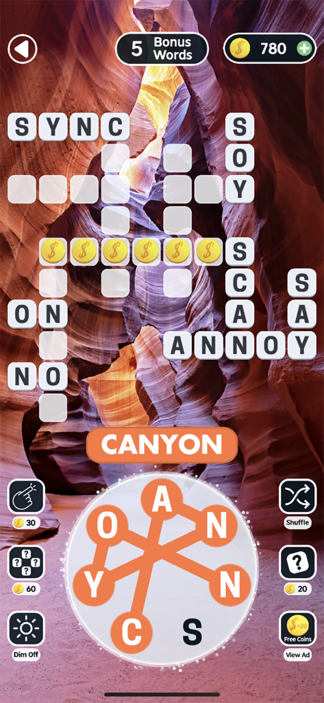 Word Swipe Connect: Crossword - A word puzzle level in Word Swipe Connect showing a crossword grid over a serene canyon backdrop.