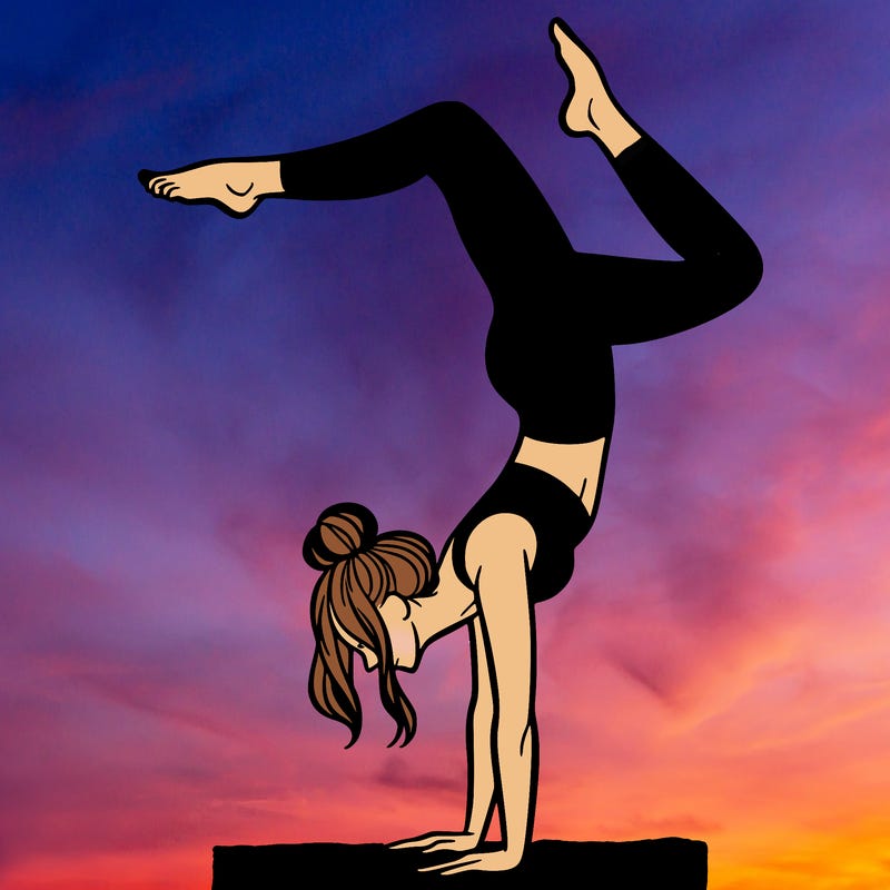 a woman doing a handstand