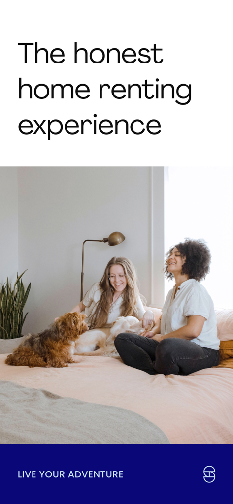 Spotahome: Apartments & rooms - Two young women laughing with a dog on a bed in a bright room illustrating a positive home renting experience.