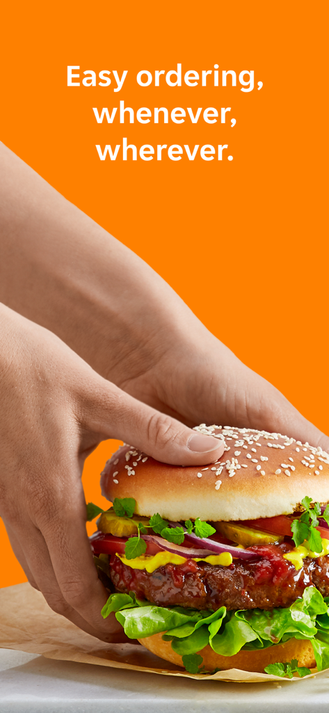 Pyszne.pl - Zwei Hände, die einen Burger vor einem orangefarbenen Hintergrund halten, mit einem Text über die einfache Bestellung jederzeit und überall