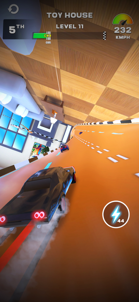 MR RACER : Stunt Mania - A black car racing on an orange stunt track in a toy house themed level in MR RACER Stunt Mania