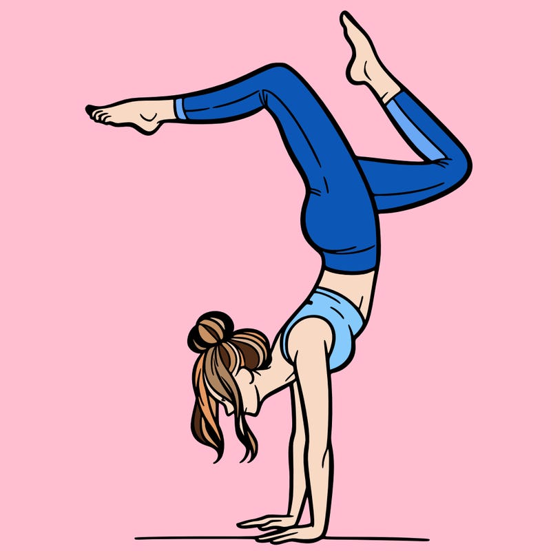 a woman doing a handstand