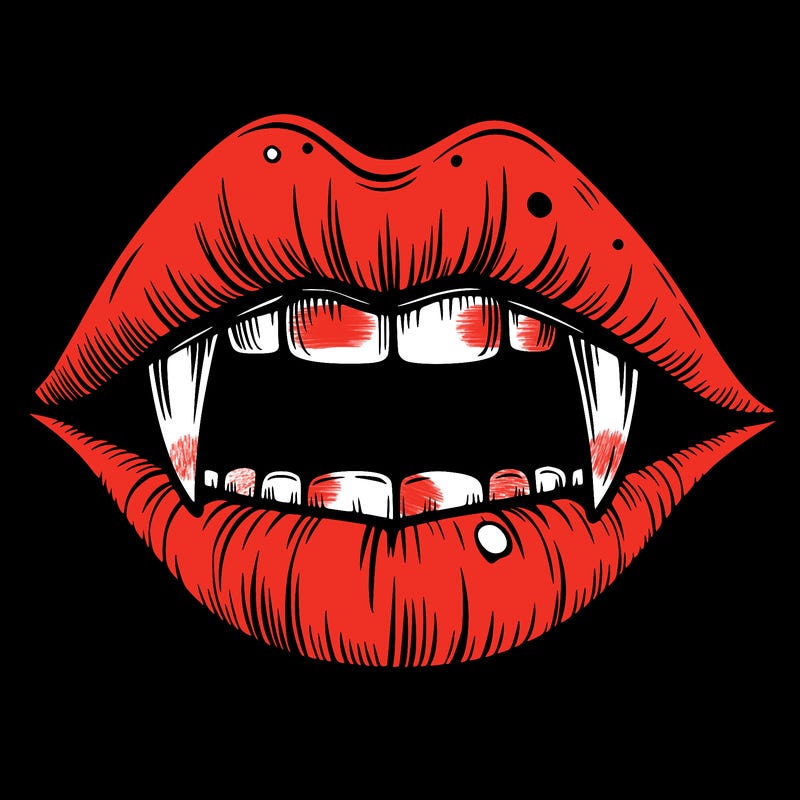 lips with vampire teeth