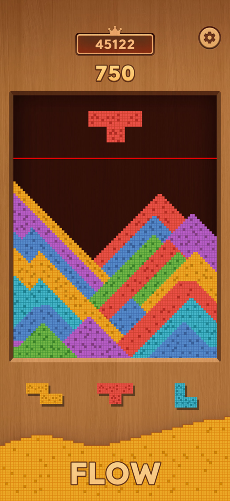 Gameplay of Sand Crush showing colorful sand particles forming hills and blocks falling in a physics based puzzle