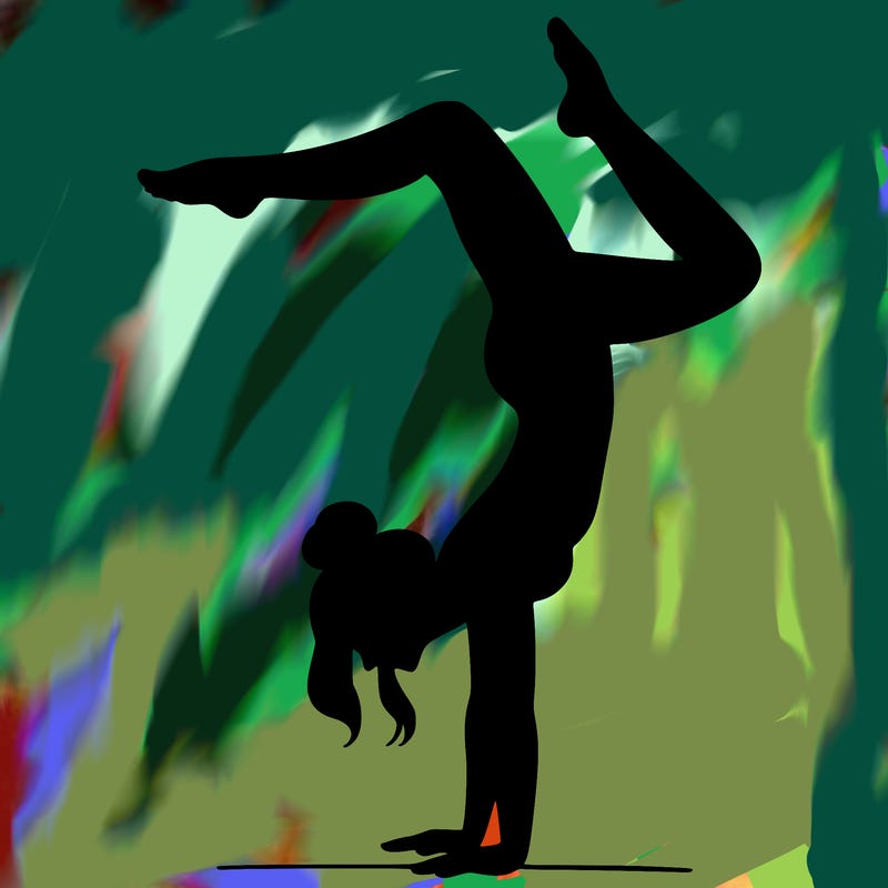 a woman doing a handstand
