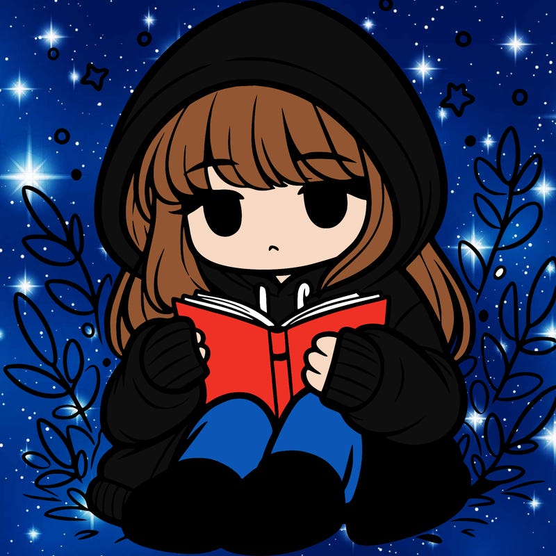 girl in oversized hoodie reading a book