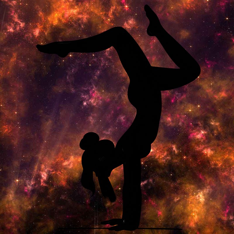 a woman doing a handstand