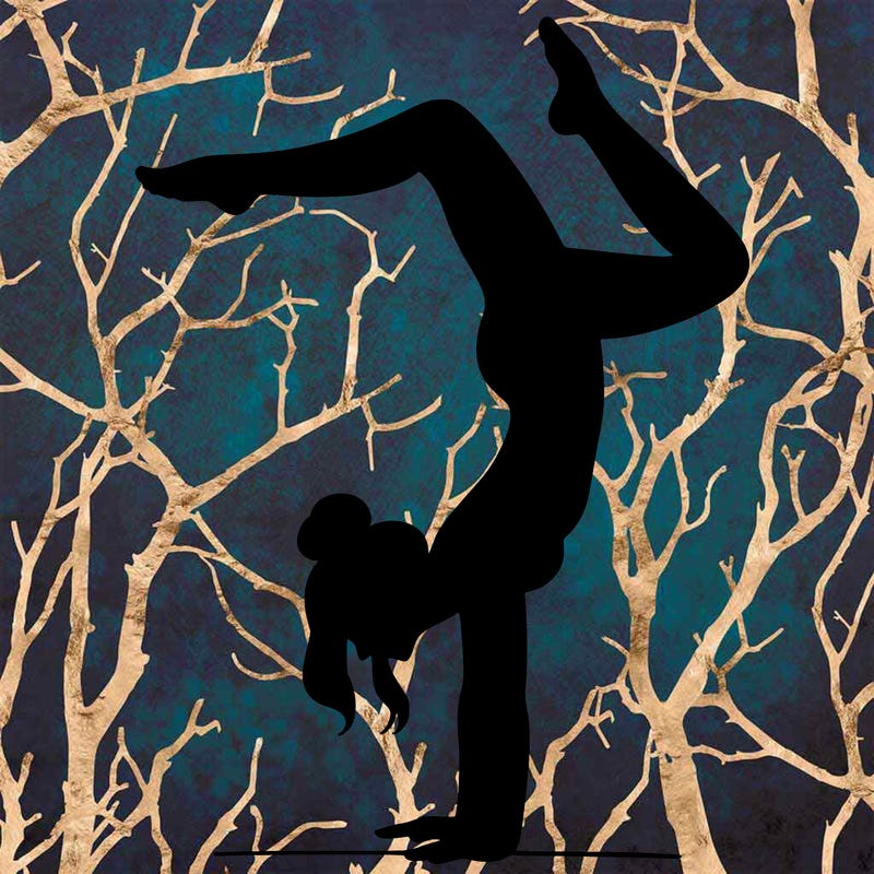 a woman doing a handstand