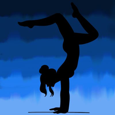 a woman doing a handstand