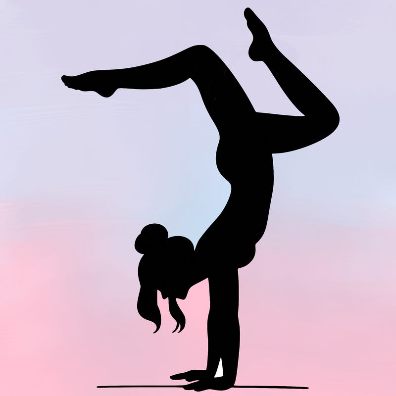 a woman doing a handstand