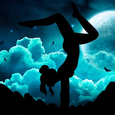 a woman doing a handstand