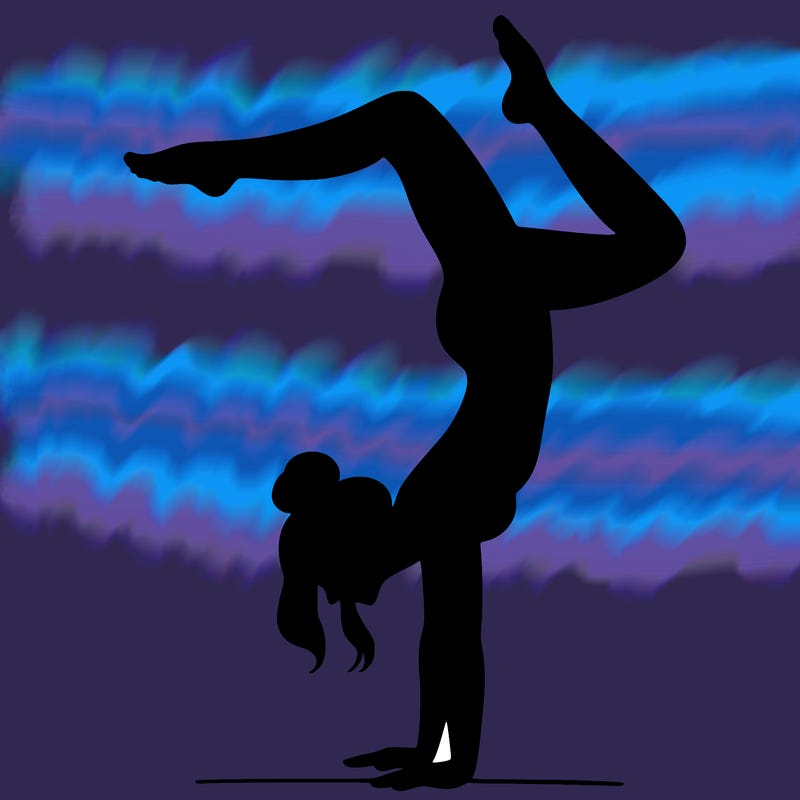a woman doing a handstand
