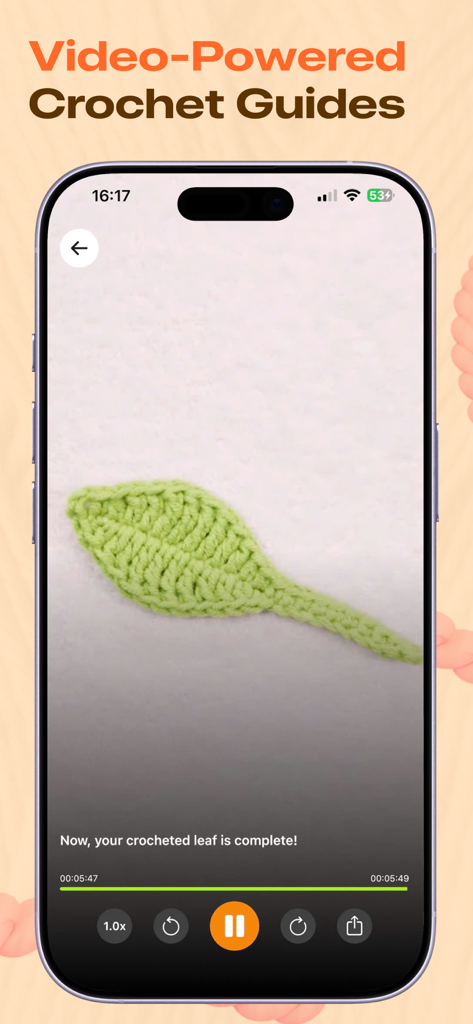 Smartphone screen displaying a video tutorial of a completed crocheted green leaf on the Yarno app.