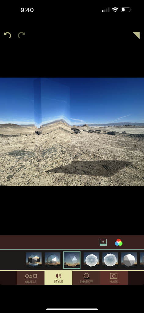A screenshot of the Matter app interface showing a tall reflective 3D prism being edited into a desert landscape photo