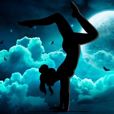 a woman doing a handstand