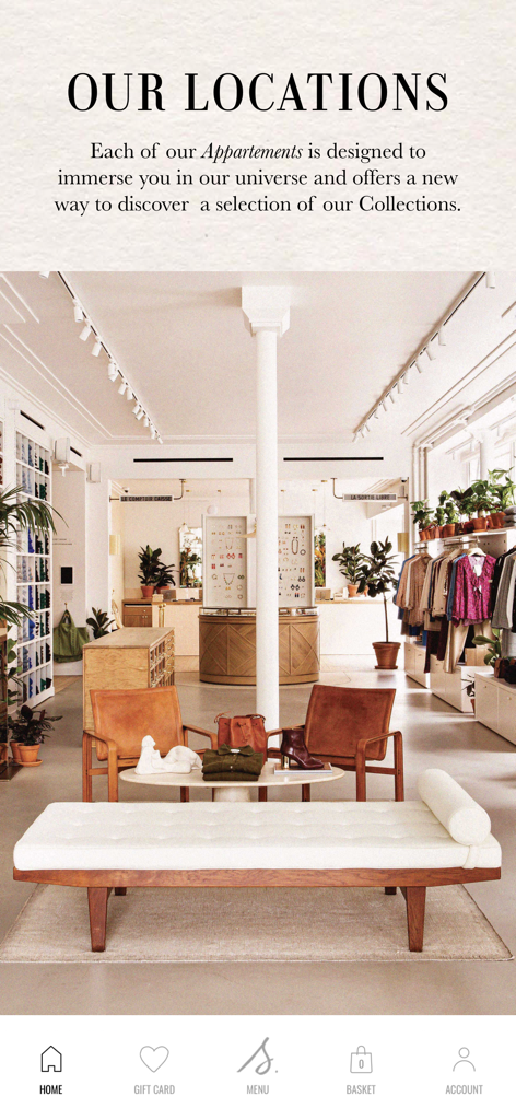 Interior view of a Sezane boutique showcasing a chic Parisian apartment style retail space