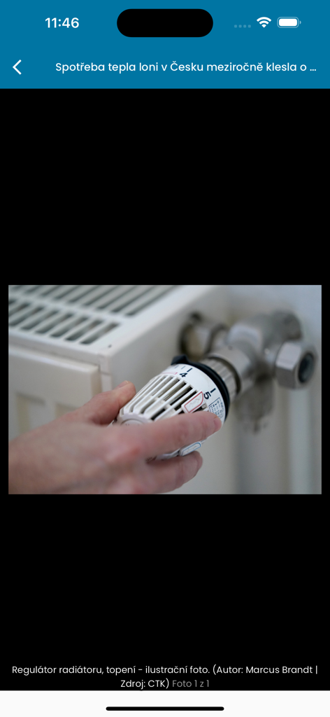 A hand adjusting a radiator thermostat in a photo gallery of the Ceske noviny news app