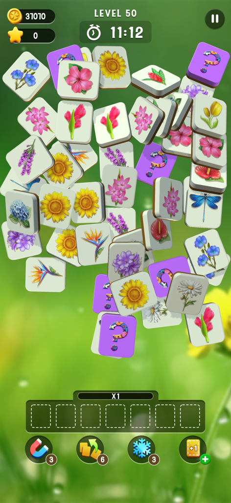 Blossom Match - A matching puzzle game screen featuring a stack of tiles with various floral designs