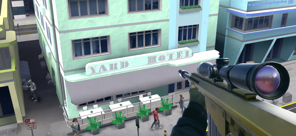 Vista en primera persona desde la mira de un rifle de francotirador sobre una calle urbana y el Yard Hotel.