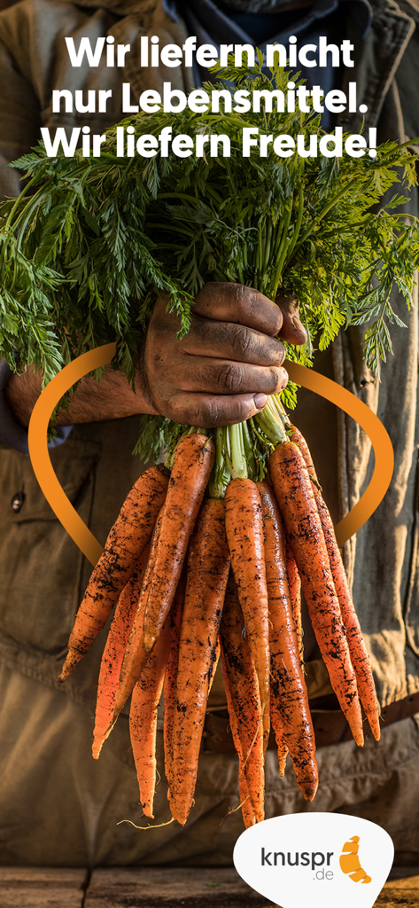 A person holding a bunch of fresh earthy carrots with green tops representing farm to table grocery delivery