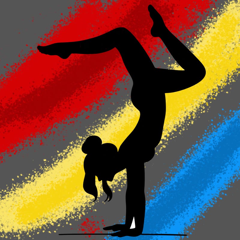 a woman doing a handstand