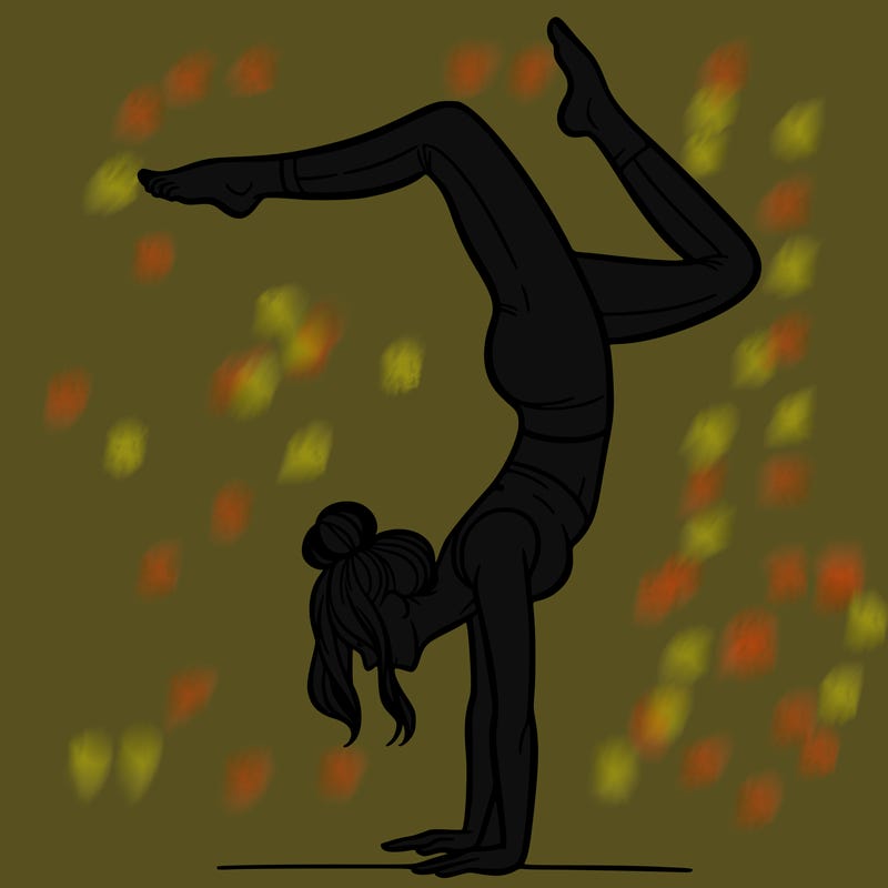 a woman doing a handstand