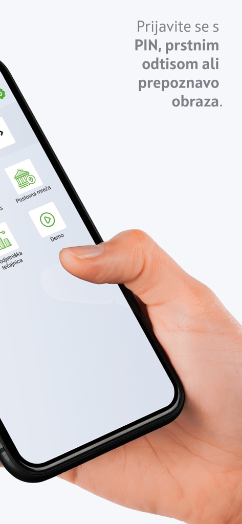 mBank@Net com - Hand holding a smartphone showing the login screen of the mBank Net com business banking application