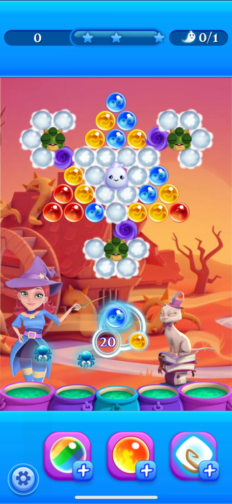 Gameplay of Bubble Witch 2 Saga featuring Stella the witch and her cat in a colorful bubble shooting level