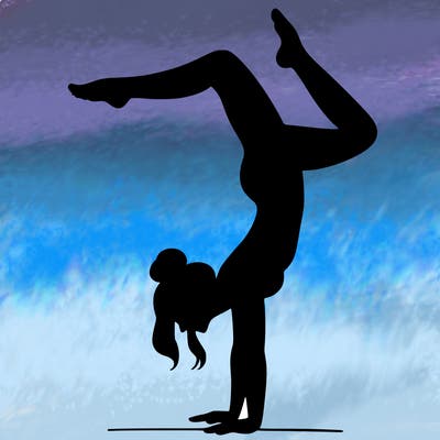 a woman doing a handstand