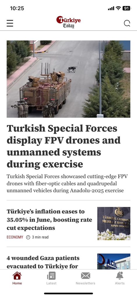 Türkiye Today - The Türkiye Today mobile app interface displaying headlines about Turkish military exercises and the national economy