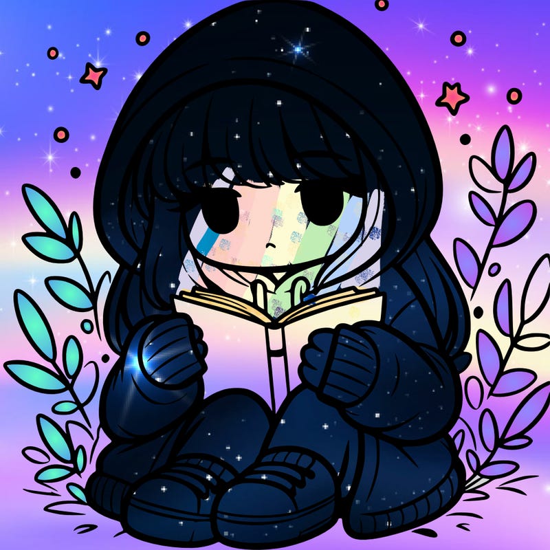 girl in oversized hoodie reading a book