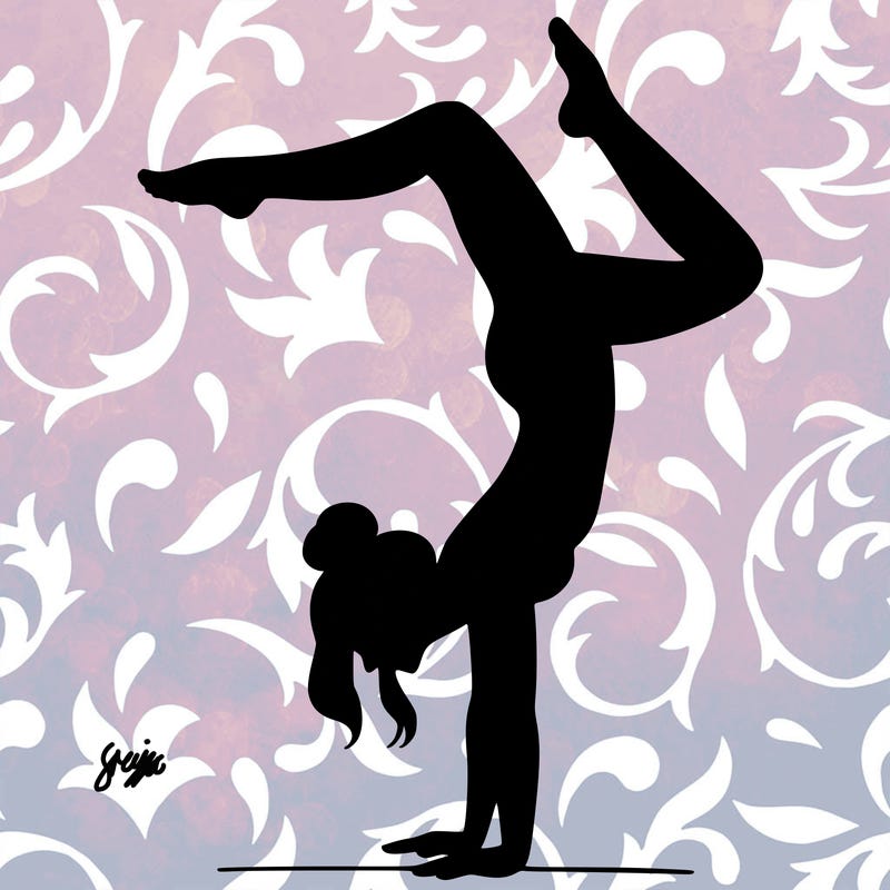 a woman doing a handstand