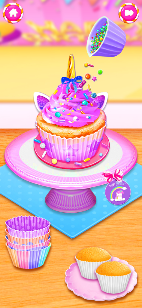 Food Cooking Baking Girl Games - A pink unicorn cupcake being decorated with colorful sprinkles on a cake stand.