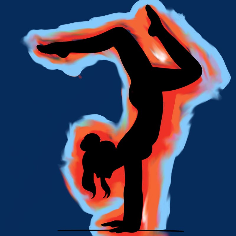 a woman doing a handstand
